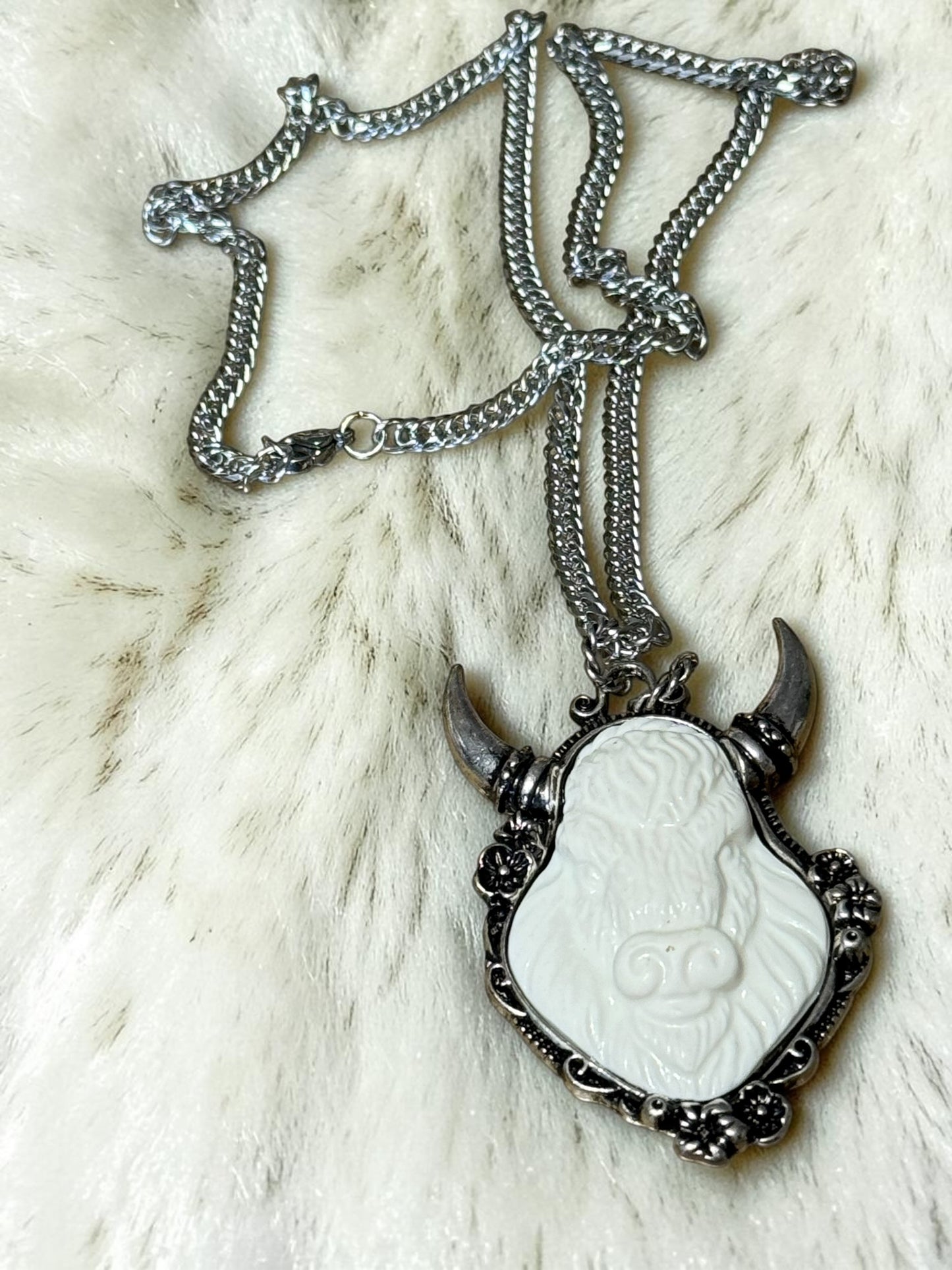 Bull horn background necklace